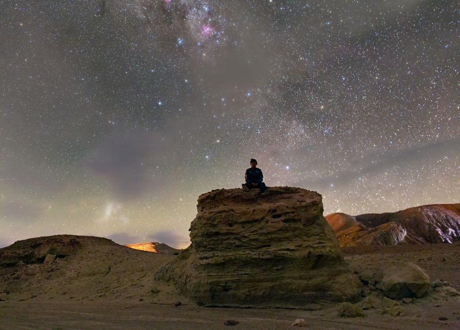 CONTEMPLING THE MILKY WAY AMIDST THE CLOUDS